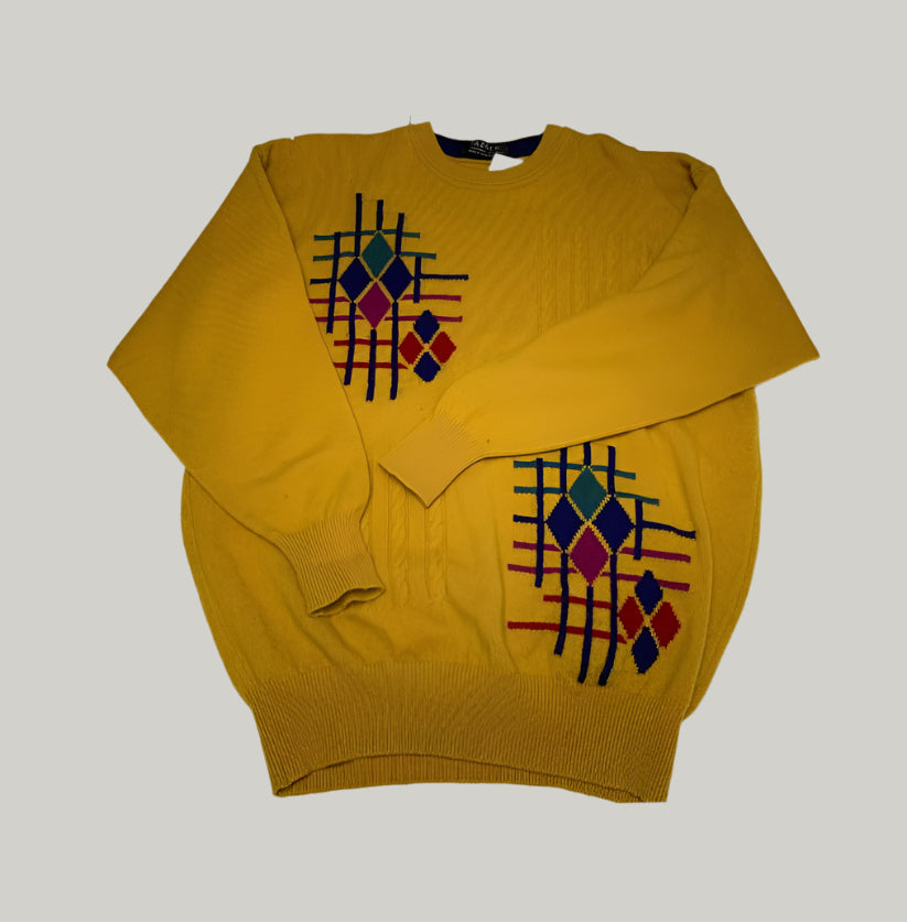 Yellow sweater with geometric pattern on a white background