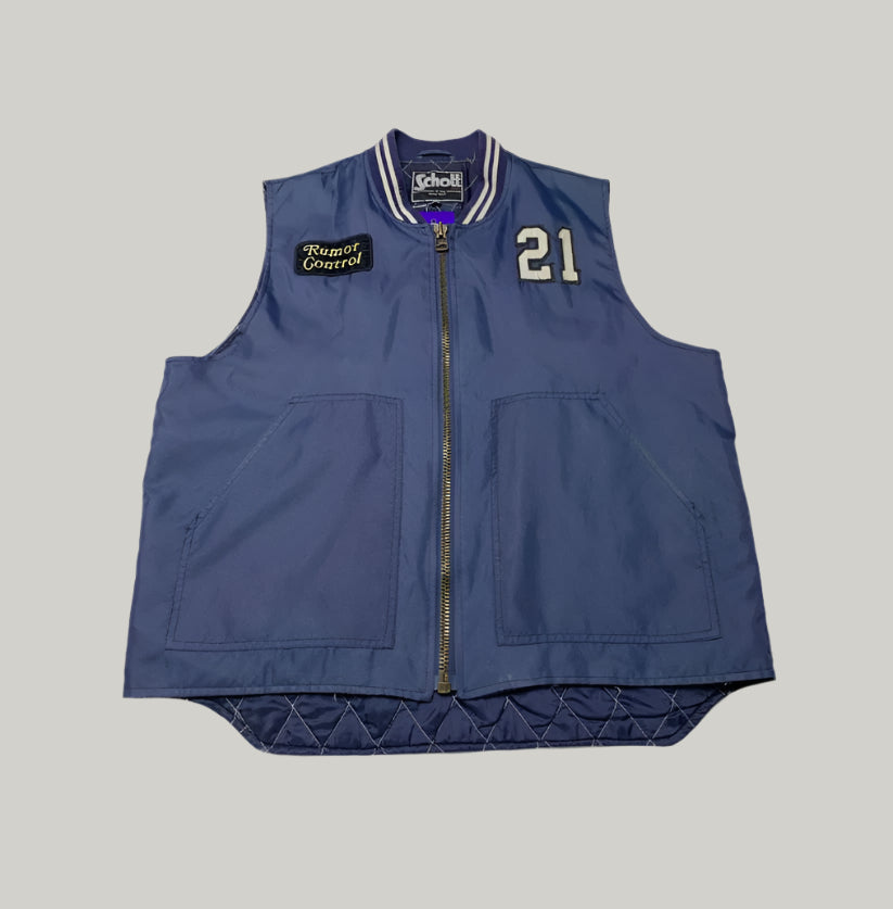 Blue vest with brand logo and number on a light background