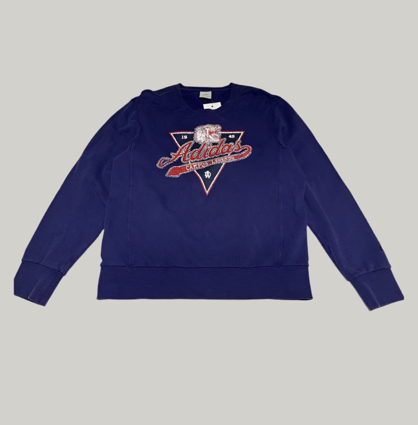 Blue Adidas sweatshirt on a light gray background