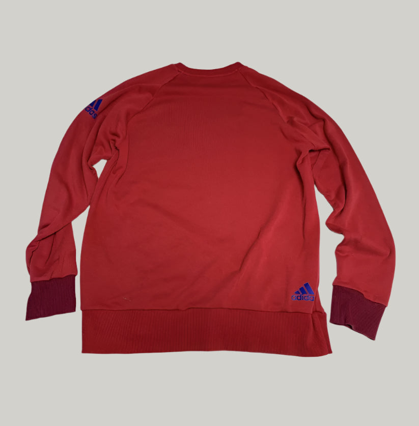 Red Adidas sweatshirt on a white background
