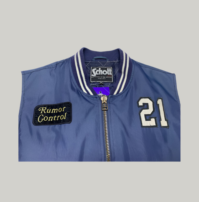 Blue jacket with 'Rumor Control' patch and '21' on a white background