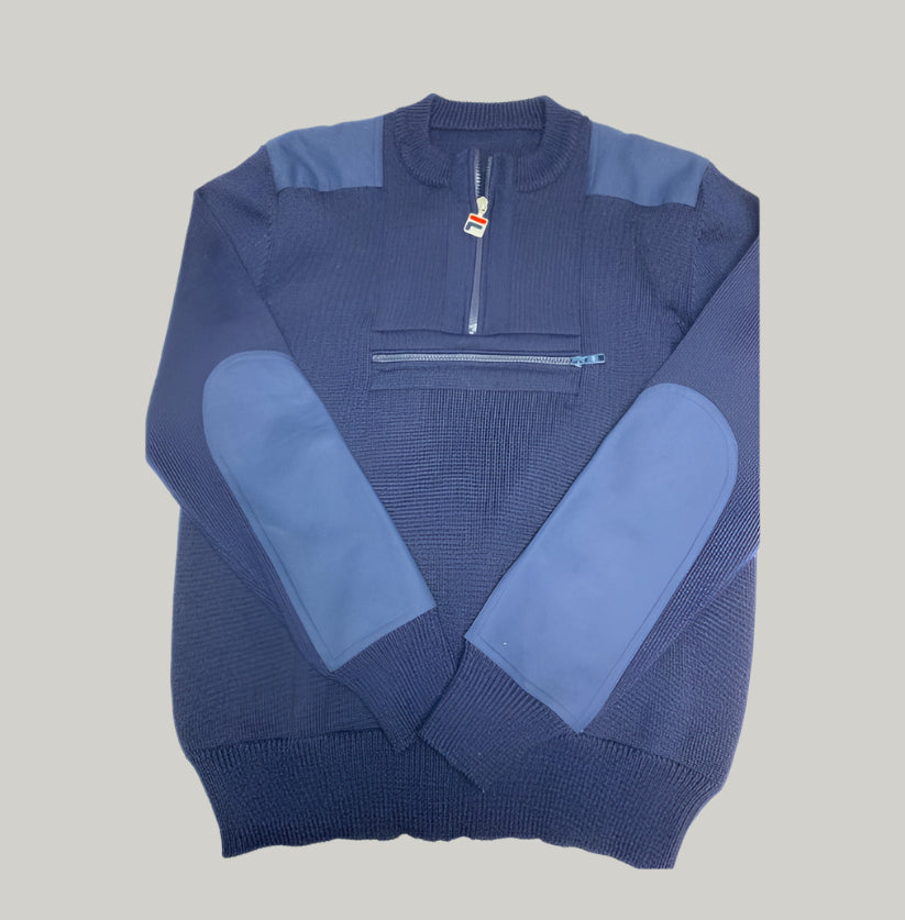 Blue sweater with a quarter zip design on a light gray background