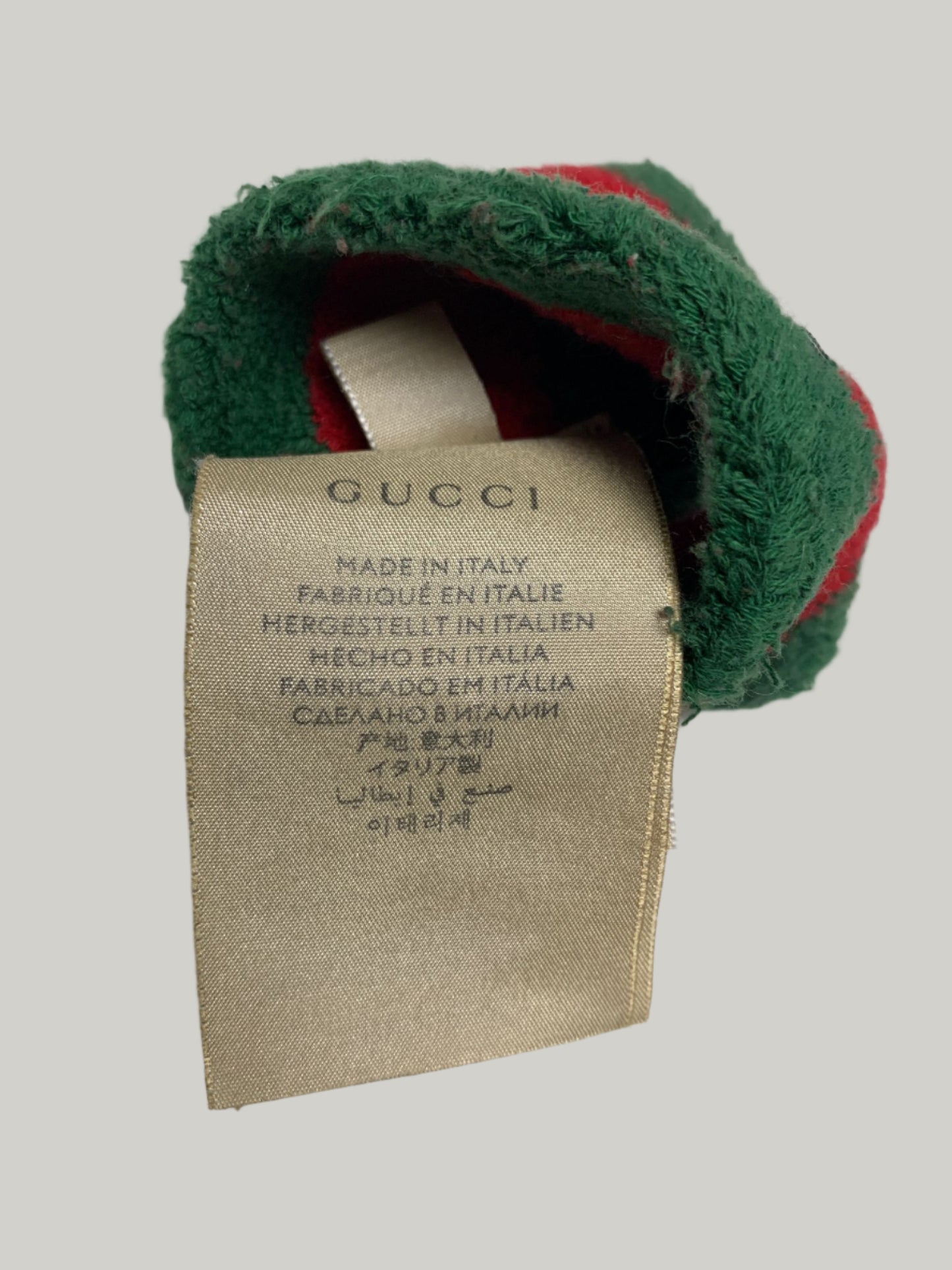 Gucci label on a green and red fabric item