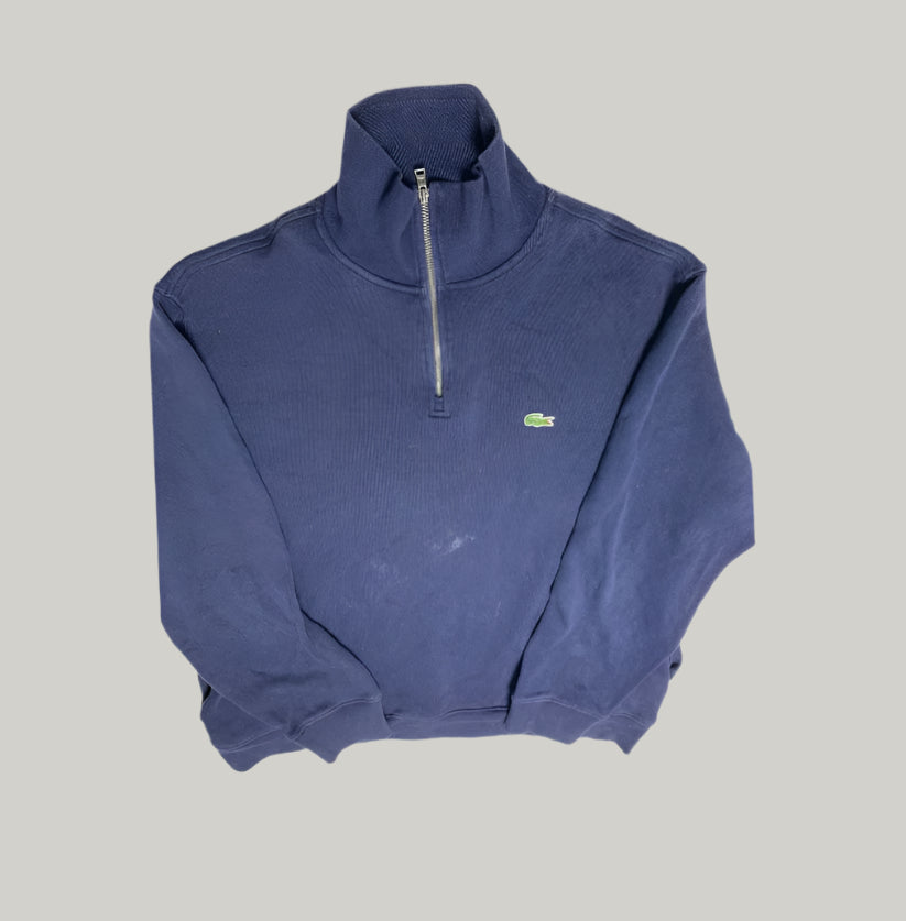 Blue half-zip sweatshirt with a brand logo on a light gray background