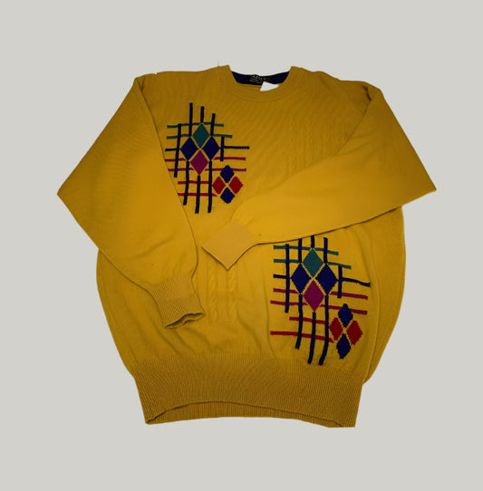 Yellow sweater with geometric pattern on a white background