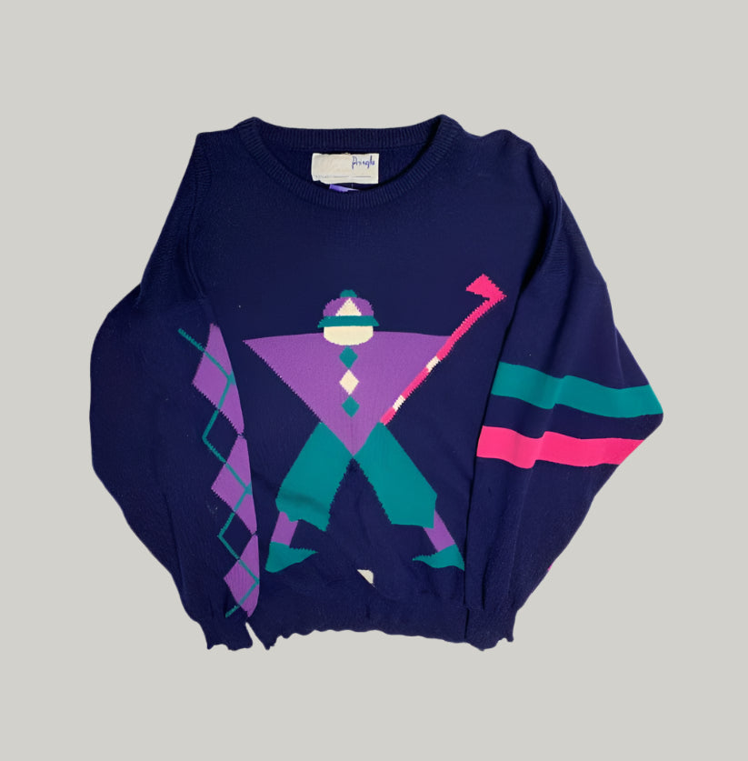 Navy blue sweater with colorful geometric design on a white background