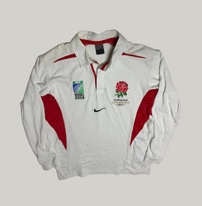 White jacket with red accents featuring rugby and World Cup 2003 logos on a light gray background.