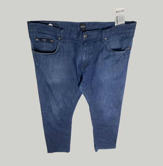 Blue jeans with a brand tag on a white background