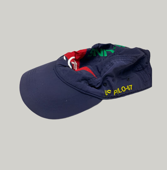 Navy blue cap with colorful text on a light gray background