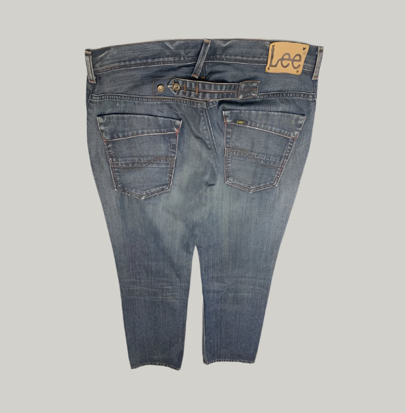 Back view of a pair of blue jeans with 'Lee' branding on a white background