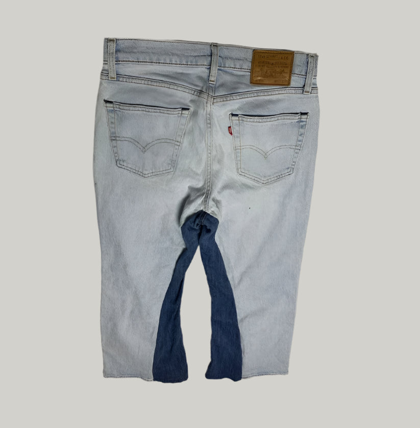Light blue jeans with a Levi's logo on a gray background