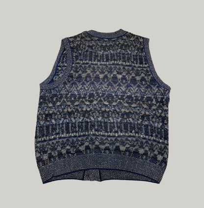 Patterned sleeveless sweater vest on a light background