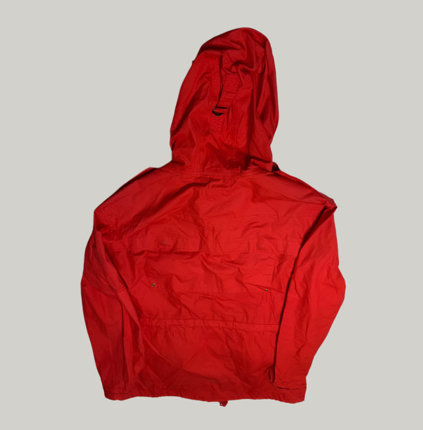 Red hooded jacket on a light gray floor