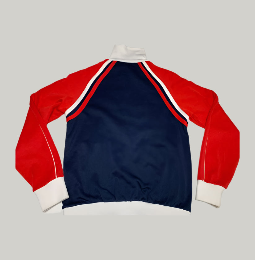 Red, white, and blue long-sleeve shirt on a light gray background