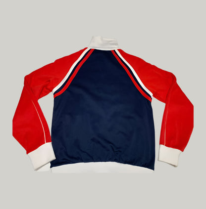 Red, white, and blue long-sleeve shirt on a light gray background