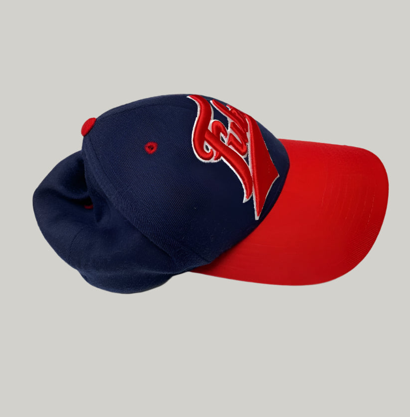 Blue and red baseball cap with logo on a white background