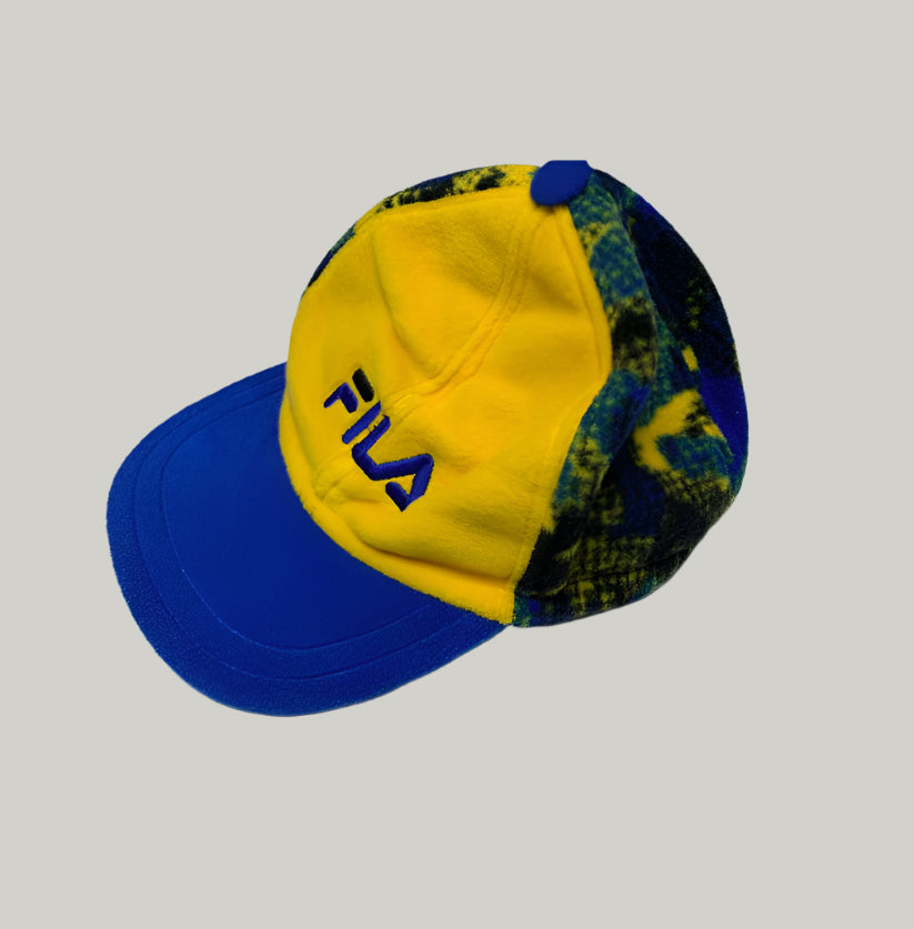 Colorful cap with 'Fila' logo on a light gray background
