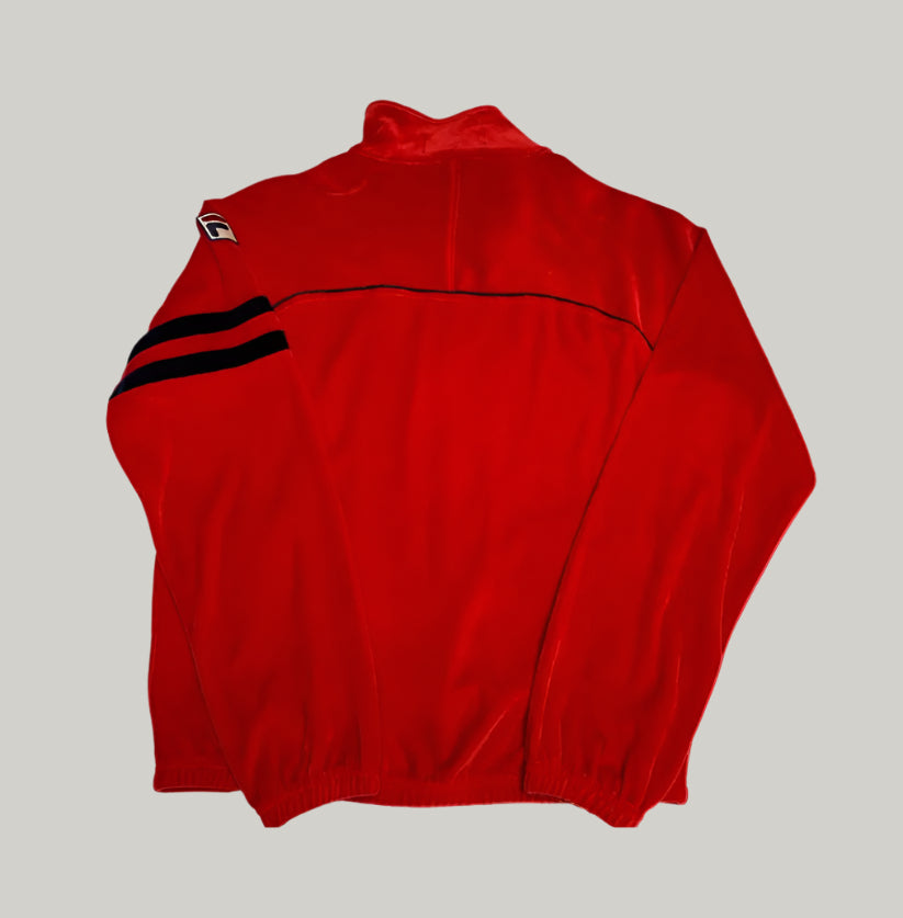 Red jacket with black accents on a light gray background