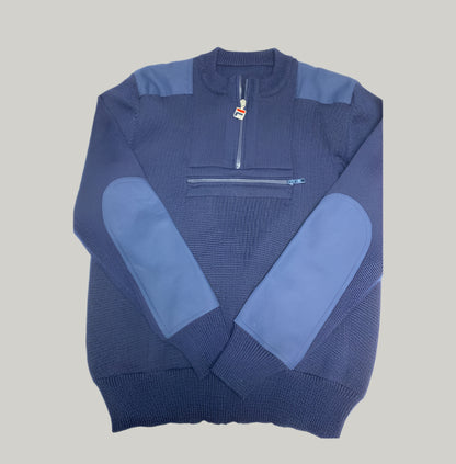 Blue sweater with a quarter zip design on a light gray background