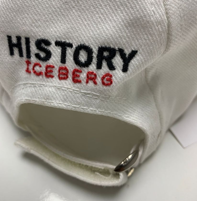 Close-up of a white sock with 'History Iceberg' text on a white background